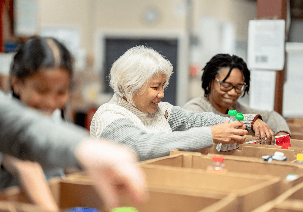 Volunteers packing donation boxes at community center
