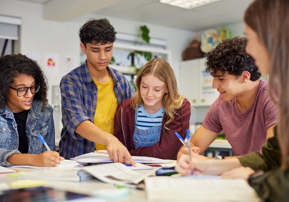 Group of students studying together around table