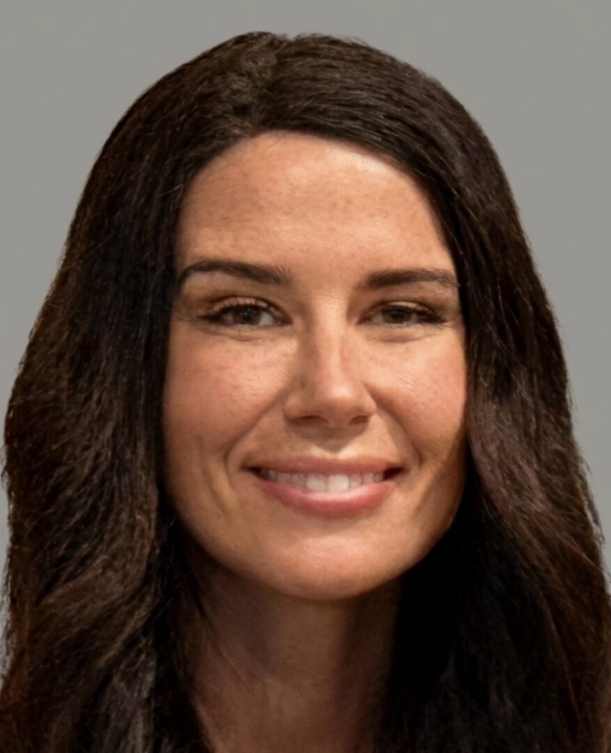 Smiling woman headshot with long dark hair